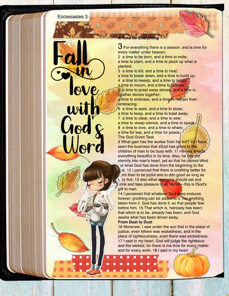May include: A page from the Bible, Ecclesiastes 3, with the text "Fall in love with God's Word" written in black lettering on a watercolor background. The page is decorated with fall-themed stickers, including leaves, a pumpkin, and a cartoon girl holding two white bunnies.