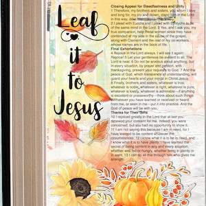 May include: A Bible page with handwritten notes and colorful fall-themed stickers. The page features the text "Leaf it to Jesus" and a passage from Philippians 4. The stickers include a sunflower, pumpkins, and fall leaves.
