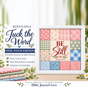 May include: A square white frame containing a Kinusaiga nine-patch grid of fabric squares with various floral, plaid, and heart patterns. The center square features the red text BE Still and Psalm 46:10. A stack of patterned fabric sits to the left.