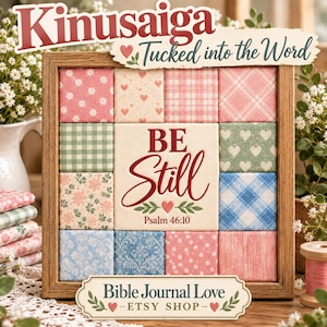May include: A square wooden frame containing a grid of twelve fabric-covered squares surrounding a central panel that reads BE Still Psalm 46:10. The fabric squares feature various patterns including pink flowers, hearts, plaid, and blue damask.