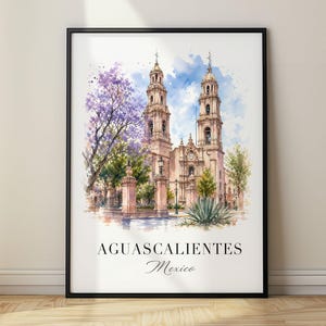 May include: A framed watercolour print featuring the cathedral of Aguascalientes, Mexico, with twin towers, a purple jacaranda tree, and an agave plant. The text AGUASCALIENTES Mexico is printed in black at the bottom of the white-bordered artwork.
