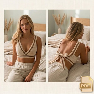 Può includere: Un top all'uncinetto color crema con strisce marroni lungo lo scollo e le spalline. Il top ha un design a scollo a V e un dettaglio a fiocco sulla schiena. L'immagine mostra il top davanti e dietro.