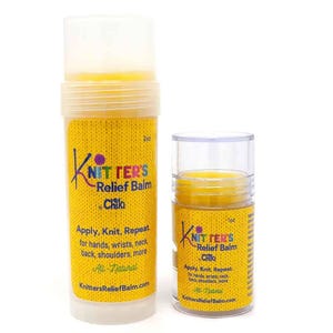 May include: Two cylindrical containers of yellow Knitters Relief Balm by Chiki with clear plastic caps. The larger container is labeled 2oz and the smaller is 1oz. Both feature yellow labels with text including Apply, Knit, Repeat.