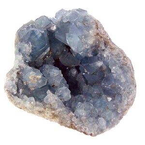 May include: A blue celestite geode with a rough exterior and a hollow interior lined with sparkling crystals.