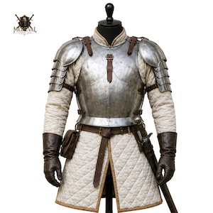 May include: A suit of steel plate armor featuring a polished metal breastplate and pauldrons over a cream-colored quilted gambeson. The ensemble includes dark brown leather gloves, a matching belt with a small pouch, and a sword scabbard.