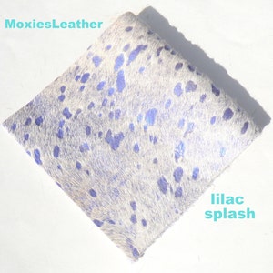 May include: White cowhide leather with a lilac splash pattern. MoxiesLeather.