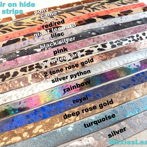 May include: A collection of hair-on hide leather strips in various colors and patterns, including pony, camo, tiger, red leopard, lilac, black/silver, pink, snow leopard, two-tone rose gold, silver python, rainbow, royal, deep rose gold, turquoise, and silver. The strips are arranged vertically, with the names of each color and pattern written next to them.