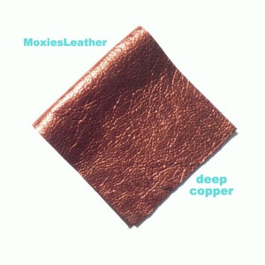 May include: A square piece of deep copper colored leather with a textured surface.  The leather is from MoxiesLeather.