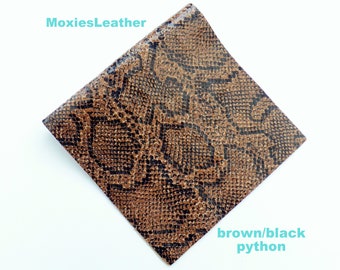 May include: Brown and black python leather with a textured snake skin pattern. MoxiesLeather.