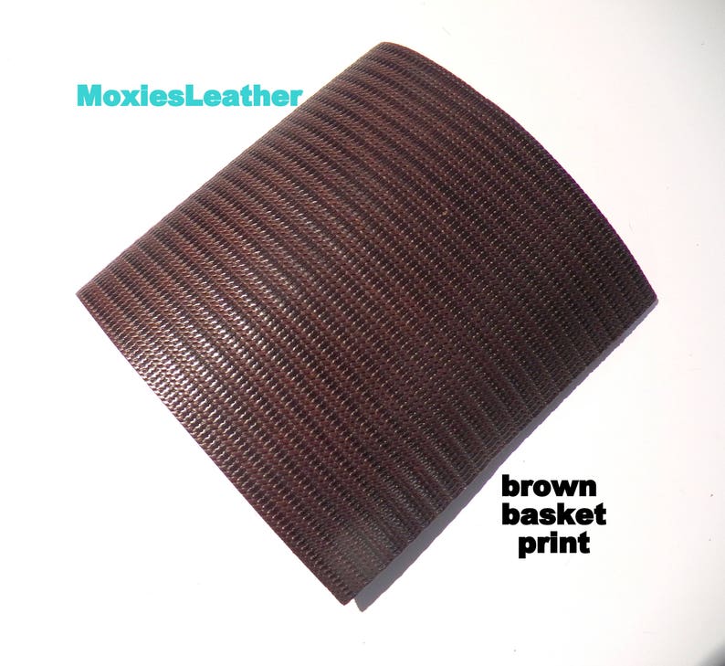 May include: Brown leather with a basket weave pattern.  The leather is textured and has a subtle sheen.