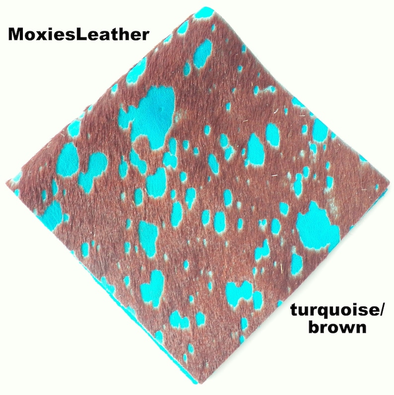 May include: Turquoise and brown cowhide leather with a spotted pattern. MoxiesLeather.