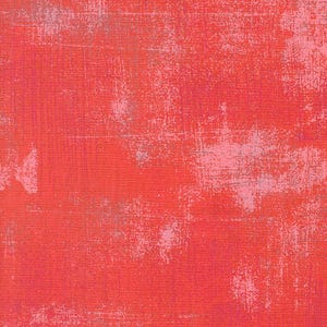 May include: A red textured fabric with a subtle pink and gray pattern. The fabric has a distressed look, giving it a vintage feel.