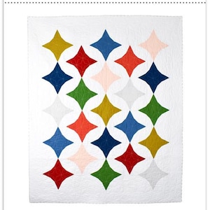 May include: A white quilt pattern titled "ZESTY" with a repeating starburst design in various colors including red, blue, green, yellow, and pink. The text "A QUILT PATTERN BY ELIANE BERGMANN" is below the quilt design. The pattern is available in baby, throw, twin, full/queen, and king sizes.