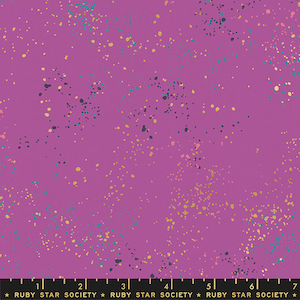 May include: Purple fabric with a speckled pattern of gold, teal, and black dots. The fabric has a subtle sheen and a soft texture. The fabric is printed with the text "RUBY STAR SOCIETY" in black.