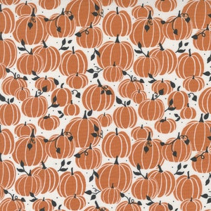 May include: A white background with a repeating pattern of orange pumpkins with black stems and leaves. The pumpkins are of various sizes and are arranged in a random pattern.