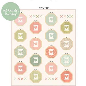 May include: A quilt pattern titled "Lovely Stitches" with a cream background. The design features octagonal shapes in pink, green, and blue, each with a heart and a sewing machine image. The quilt measures 67" x 80".