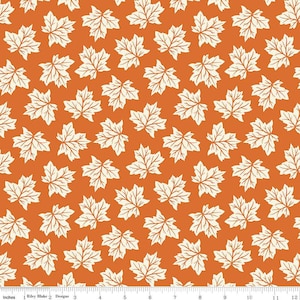 May include: A seamless fabric pattern featuring a repeating design of white maple leaves on an orange background.