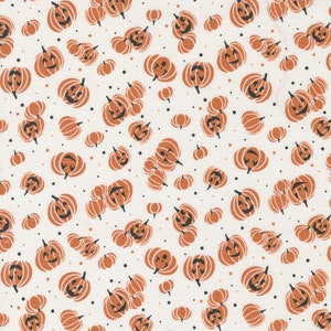 May include: A white fabric with a repeating pattern of orange jack-o'-lantern faces. The jack-o'-lanterns are outlined in black and have a simple, smiling face.