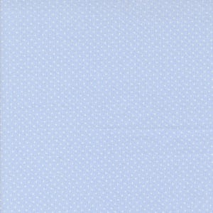 May include: Light blue fabric with a repeating pattern of small white polka dots. The fabric has a woven texture, and the dots are evenly spaced across the surface. This textile is suitable for various sewing and crafting projects.