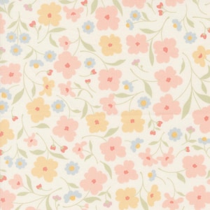 May include: A white fabric with a repeating pattern of pink, yellow, and blue flowers. The flowers are stylized and have a simple design.