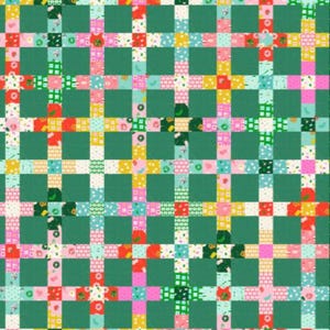 May include: A colorful patchwork quilt with a grid pattern. The quilt features a variety of patterned squares in shades of pink, red, yellow, and green, separated by solid green blocks. The patterns include floral and geometric designs.