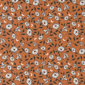 May include: A seamless pattern featuring white stylized flowers and crescent moons on a brown background.