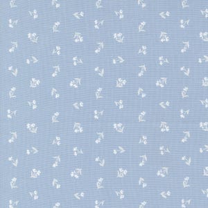 May include: A light blue fabric with a white floral pattern. The fabric is a solid light blue color with a repeating pattern of small white flowers.