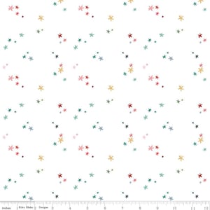 May include: White fabric with a scattered pattern of small, colorful star-like shapes in red, green, yellow, and pink. The fabric is measured in inches, with the Riley Blake Designs logo at the bottom.