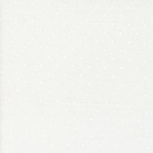 May include: White fabric with a small white polka dot pattern.