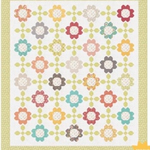 May include: A floral quilt with a white background and a repeating pattern of colorful flower shapes. The flowers are in shades of red, orange, yellow, blue, and gray, with a patterned center. The quilt has a light green border with small dots and the text "PRECUT FRIENDLY".