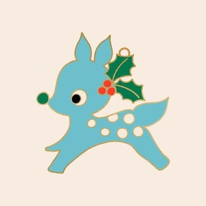 May include: A blue reindeer ornament with white spots and a green holly sprig with red berries.
