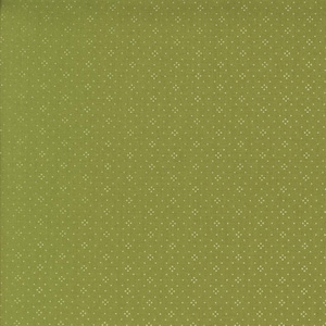 May include: Close-up of a green fabric with a repeating pattern of small, off-white dots. The dots are arranged in a grid-like formation, creating a subtle textured effect across the surface of the fabric. The fabric has a matte finish.
