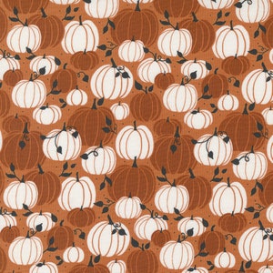May include: A seamless pattern featuring white pumpkins on a brown background. The pumpkins are of various sizes and are arranged in a random pattern. The background is a solid brown color.