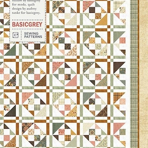 May include: A patchwork quilt with a repeating geometric pattern in shades of brown, green, pink, and cream. The quilt features squares and triangles, with a plaid border. The text "ALWAYS AUTUMN" and "PAT080" are visible.