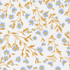 May include: White fabric with a repeating pattern of blue daisies with yellow centers and gold-colored stems and leaves. The floral design is evenly distributed across the fabric's surface.