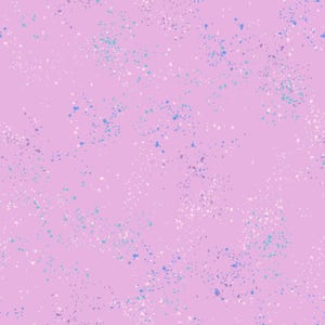 May include: A seamless pattern featuring a light purple background with scattered paint splatters in shades of blue, white, and purple. The design has a speckled, textured appearance, suitable for fabric or wallpaper.