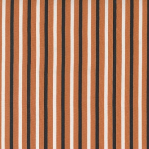 May include: A fabric with alternating brown and white stripes. The stripes are vertical and evenly spaced.