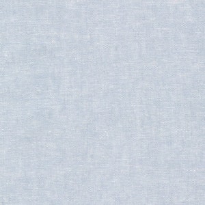 May include: A seamless, light blue fabric with a subtle woven texture. The material has a soft, muted appearance, suggesting a linen or cotton blend. The overall effect is a solid, uniform color with a slightly irregular surface.