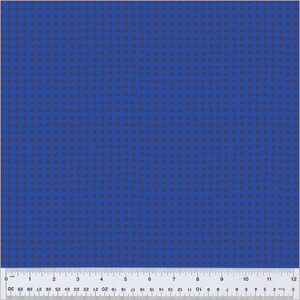 May include: A blue fabric with a repeating pattern of small, dark brown circles.