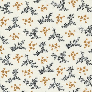 May include: A white fabric with a repeating pattern of small black floral sprigs and gold triangles.