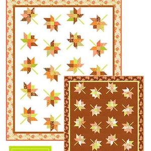 May include: Two quilt patterns, "Twirl Revisited", feature leaf-like designs in shades of orange, green, and brown. The patterns are set against white and brown backgrounds, with floral borders. The text "Jelly Roll Friendly!" is visible.