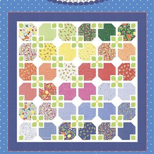 May include: A quilt pattern titled "#236 Flower Tiled" by Coriander Quilts. The design features a grid of colorful, flower-shaped blocks in various patterns and colors, including red, yellow, green, and blue, set against a blue background.