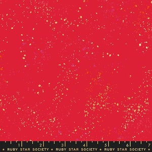 May include: Red fabric with a scattered gold and pink glitter pattern.  The fabric is a solid red color with a subtle sheen.  The glitter is randomly distributed across the fabric, creating a sparkly effect.