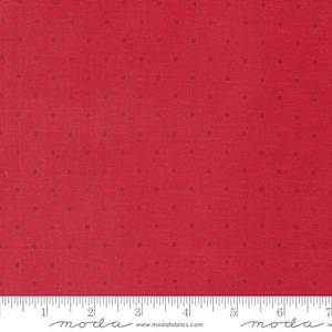May include: Red fabric with small, evenly spaced brown dots. The fabric has a textured appearance and a ruler is at the bottom. The fabric is suitable for quilting, sewing, and various craft projects.