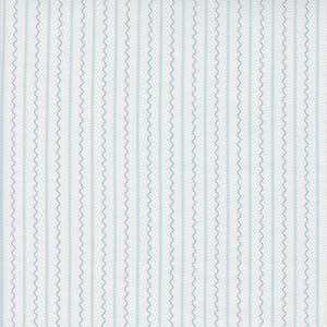 May include: White fabric with thin, light blue wavy lines.