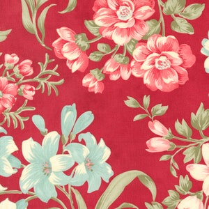 May include: A red fabric with a floral pattern. The flowers are pink, white, and blue. The fabric has a vintage feel.