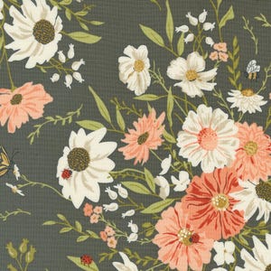 May include: A floral fabric with a dark gray background featuring white and peach flowers with green leaves.
