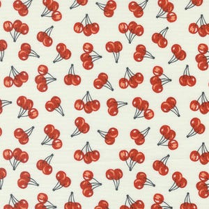 May include: A white fabric with a repeating pattern of red cherries. The cherries are arranged in groups of three and have dark stems.