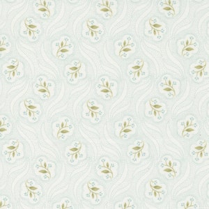 May include: A white fabric with a repeating pattern of small blue dots and green leafy sprigs. The pattern is arranged in a wavy, flowing design.