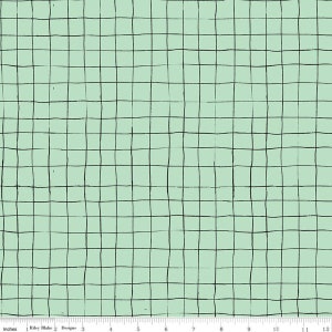 May include: A fabric with a light green background and a black grid pattern. The grid lines are uneven, giving a hand-drawn appearance. The image includes a ruler with inches.
